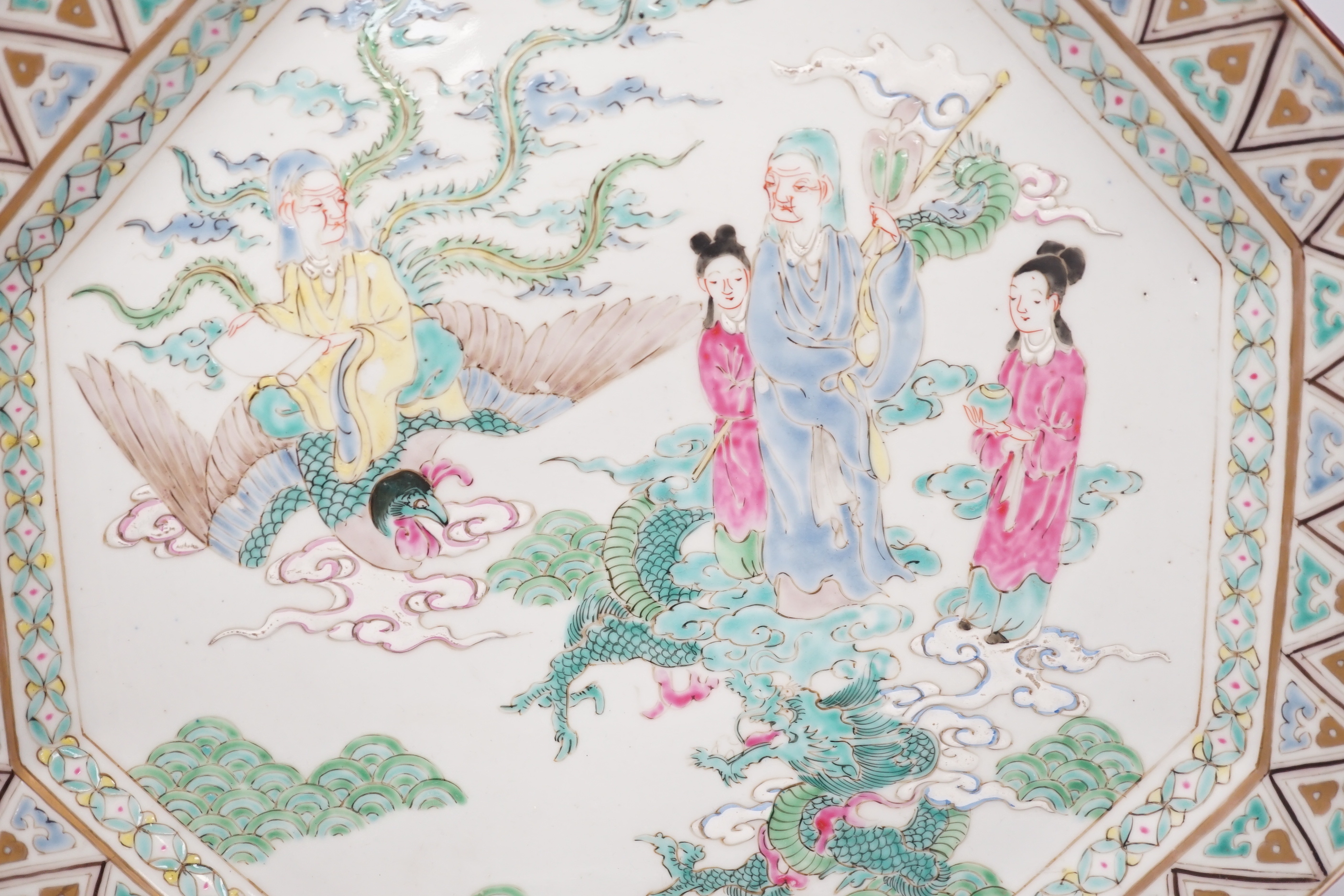 A Japanese porcelain octagonal dish enamelled with figures, dragon and bird, Meiji period, 36cm high